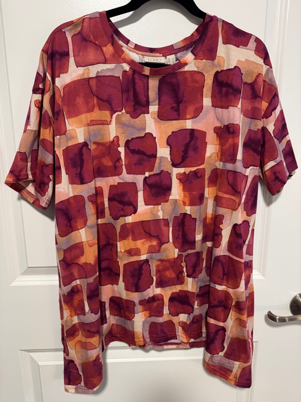 LOGO short sleeve cotton top with sharkbite hemline. NWOT. Never worn.